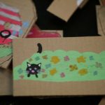 Cardboard cutout of cat in the bushes