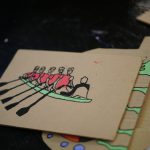 Image of rowers on cardboard